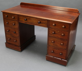 A Victorian mahogany desk/dressing table with raised back, fitted 1 long drawer, the pedestal fitted 8 short drawers with tore handles 78cm h x 122cm w x 55cm d  (this desk is in one section) 