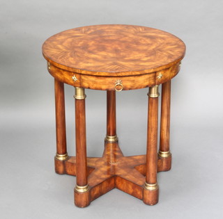 In the manner of Brights of Nettlebed, a Georgian style circular figured and crossbanded mahogany occasional table, having a frieze drawer with metal armorial within, raised on 5 columns and base formed of a 5 pointed star with coronet 70cm h x 66cm diam. 