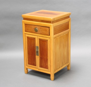 A Chinese light Padauk bedside chest with 1 long drawer above a double cupboard 76cm h x 44cm w x 43cm d 