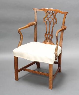 A Georgian mahogany Chippendale style slat back carver chair with pierced vase shaped slat back and over stuffed seat of serpentine outline, raised on square tapered supports with H framed stretcher 