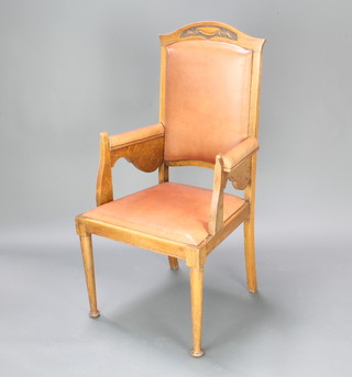 An Art Nouveau oak show frame throne/carver chair upholstered in brown leather effect material 
