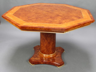 Turri of Italy, a Regency style walnut finished octagonal extending pedestal dining table, raised on a circular pedestal with triform base 121cm w x 75cm h x 120cm l x 161cm when extended