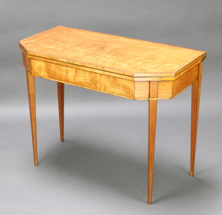 A 19th Century crossbanded satinwood card table with ebonised stringing, raised on square tapered supports 72cm h x 94cm w x 47cm d 