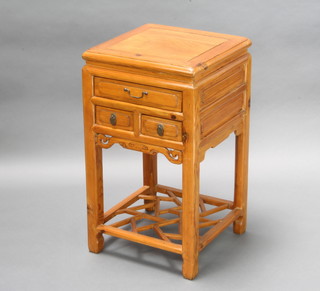A Chinese light Padauk square bedside table fitted 3 drawers, having a fretted undertier 78cm h x 44cm w x 44cm d  