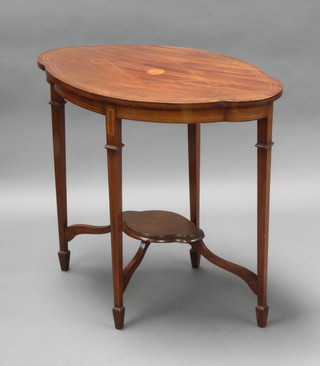 An Edwardian oval inlaid mahogany 2 tier occasional table with undertier, raised on 4 square tapered supports, spade feet, 72cm h x 77cm w x 49cm d 