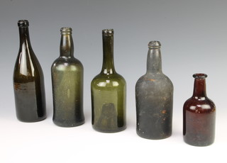 A 19th Century green glass wine bottle 25cm and 4 others