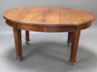An Edwardian Art Nouveau mahogany oval extending dining table with 2 extra leaves raised on square tapered supports 74cm h x  106cm w x 150cm l when closed x 239cm l with the extra leaves 