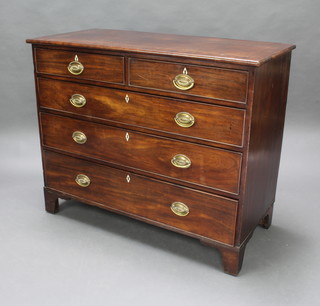 A Georgian rectangular mahogany chest with cross banded top, fitted 2 short and 3 long drawers with ivory diamond shaped escutcheons, raised on bracket feet 94cm h x 114cm w x 54cm d  
