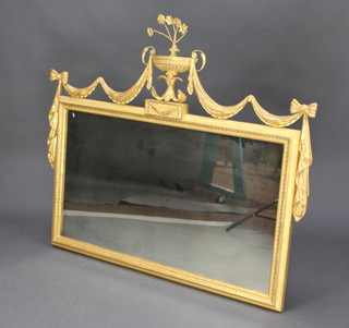A Regency style rectangular plate wall mirror contained in a decorative gilt frame surmounted by an urn 109cm x 106cm 