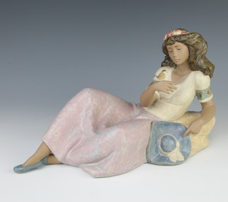 A Lladro matt figure of a reclining girl with bird 2251 36cm 