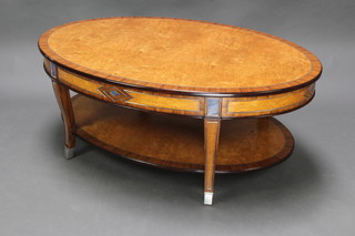 Theodore Alexander, from The Hermitage collection,  an oval birds eye maple and cross banded 2 tier occasional table fitted 2 drawers, raised on out swept supports, marked Hermitage Theodore the official collection authorised by the State Hermitage Museum St Petersburg Russia 45cm h x 117cm w x 91cm   