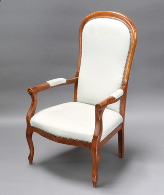 A Victorian style mahogany show frame open arm chair upholstered in light blue material, raised on cabriole supports 