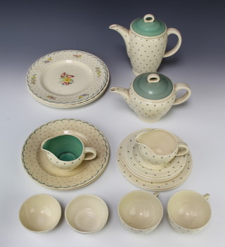 A Susie Cooper part tea and coffee set comprising 2 tea cups, 3 saucers, 2 sugar bowls, a cream jug, milk jug, tea pot, coffee pot, 2 small plates, 2 medium plates and 3 large plates 