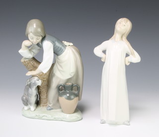 A Lladro figure of a girl patting a dog 20cm and a do. of a girl in a nightdress 20cm 