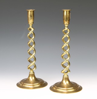 A pair of Victorian brass spiral turned candlesticks, raised on circular bases 31cm h x 13cm diam. 