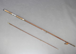 A Davanney 10'6" spinning fishing rod with detachable butt 