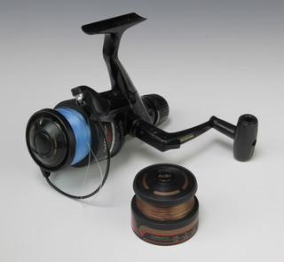 A Daiwa PG2050 long cast multiply fishing reel together with spare spool 
