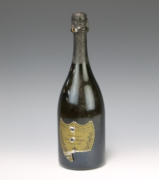 A bottle of 1985 Dom Perignon champagne (label damaged) 