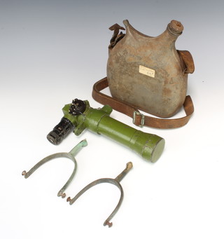 A gun sight, a Continental metal water bottle and a pair of spurs 