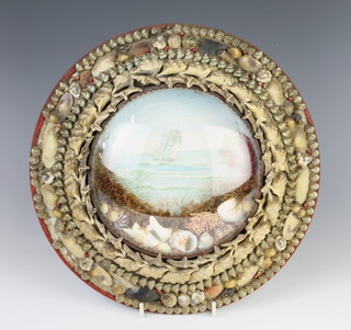 A 19th Century sailors momento, the centre with a print of a sailing ship and contained in a circular shell encrusted frame 29cm diam. 