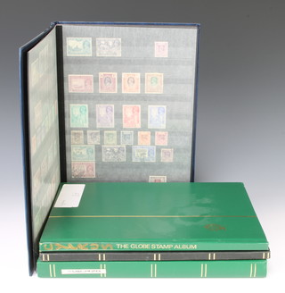 A blue stock book of mint and used Burmese stamps George V and later, a stock book of Barbadian and St Helen stamps Elizabeth II, do. Cyprus and do. Iceland  