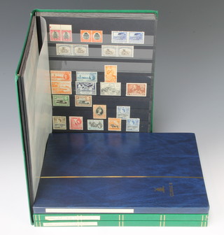 A stock book of colonial mint and used stamps including imperial British East Africa, East Africa and Uganda, Kenya and Uganda, Kenya Tanganyika, Uganda, Zanzibar Victoria to Elizabeth II, stock book of mint and used Mozambique stamps, 2 stock books of Belgian Congo etc  