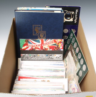 A large collection of Elizabeth II GB presentation stamps and a stock book of world stamps etc 