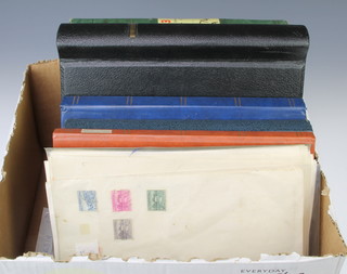 A stock book of mint and used New Zealand stamps, a stock book of German mint and used stamps and 3 stock books of world stamps including Spain, Thailand, Canada 