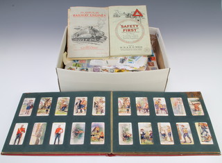 An album of Wills cigarette cards and a small collection of stamps and cigarette cards contained 2 shoe boxes 