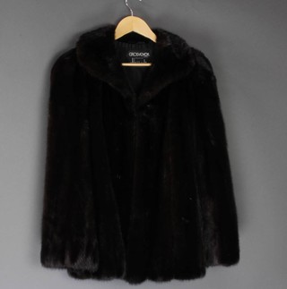 Grosvenor Canada, Exclusively for Harrods, a lady's quarter length black fur coat  