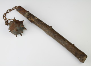 A reproduction iron and wooden flail 