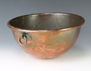 An 18th/19th Century circular copper bowl with ring handles, with coronet mark beneath a Z and also marked with a walking cockerel 18cm x 32cm diam. 
