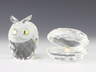 A Swarovski Crystal owl 7cm, a do. oyster shell 6.5cm boxed 