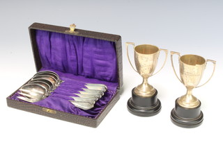 Two silver 2 handled trophy cups London 1962 and 1966 120 grams, 6 teaspoons and a fork 
