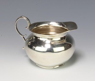 A silver cream jug with S scroll handle Birmingham 1916 140 grams 