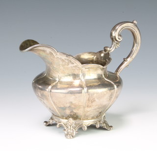 A Victorian silver cream jug with S scroll handle on scroll feet, London 1847 maker Roland Ward 200 grams 