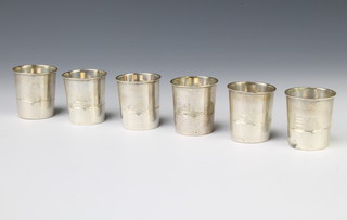 A set of 6 Egyptian silver tots with chased decoration 169 grams