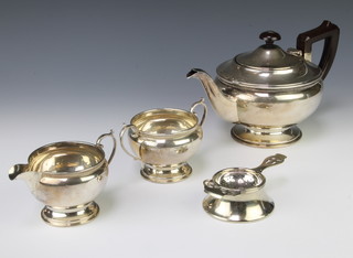 A silver 3 piece tea set with fruitwood handle and plated tea strainer and stand, gross 646 grams Birmingham 1945-46 Maker Roberts & Dore
