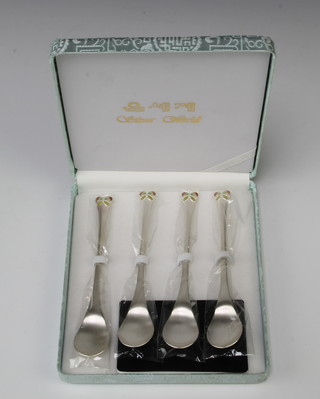 A set of 4 800 standard spoons with enamelled ends 