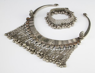 An Arabic silver necklace with tassel decoration and a similar bracelet, 357 grams 