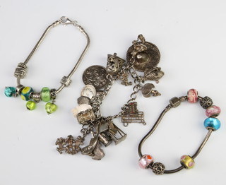 A silver charm bracelet and 2 modern ditto 147 grams