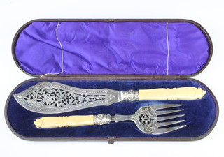 A pair of Edwardian silver plated pierced fish servers cased