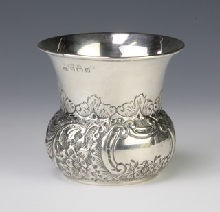 An Edwardian repousse silver vase with floral decoration and vacant cartouche Birmingham 1902, 8cm, 96 grams