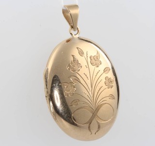 A 9ct yellow gold oval locket chased with flowers 15 grams 
