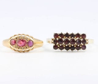 An 18ct yellow gold ruby and diamond ring size P 1/2 and a garnet set ring size Y 