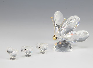 A Swarovski Crystal group of chicks 014824/7676020003 1988 by Gabriele Stamey and a Swarovski Crystal butterfly (large) with rhodium antena 001002/7639055000 1982 6cm, boxed 