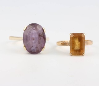 A 9ct yellow gold amethyst ring size S 1/2 and a 14ct yellow gold citrine ring size P  