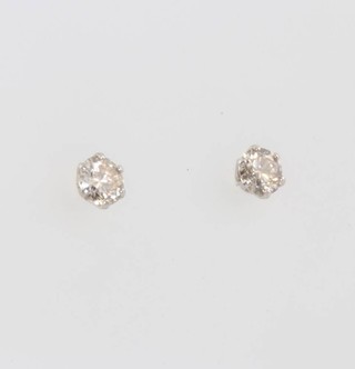 A pair of platinum and diamond ear studs, approx 0.30ct