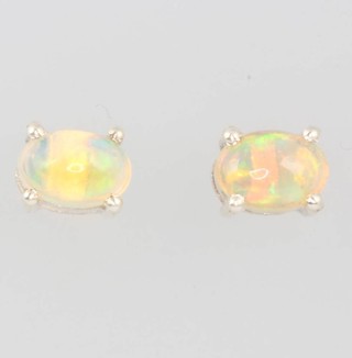 A pair of silver Ethiopian opal ear studs 