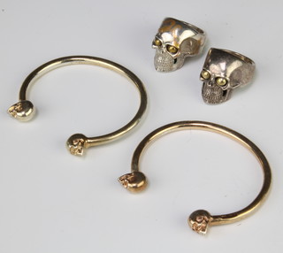 A silver gilt skull bangle, 1 other and 2 rings 84 grams